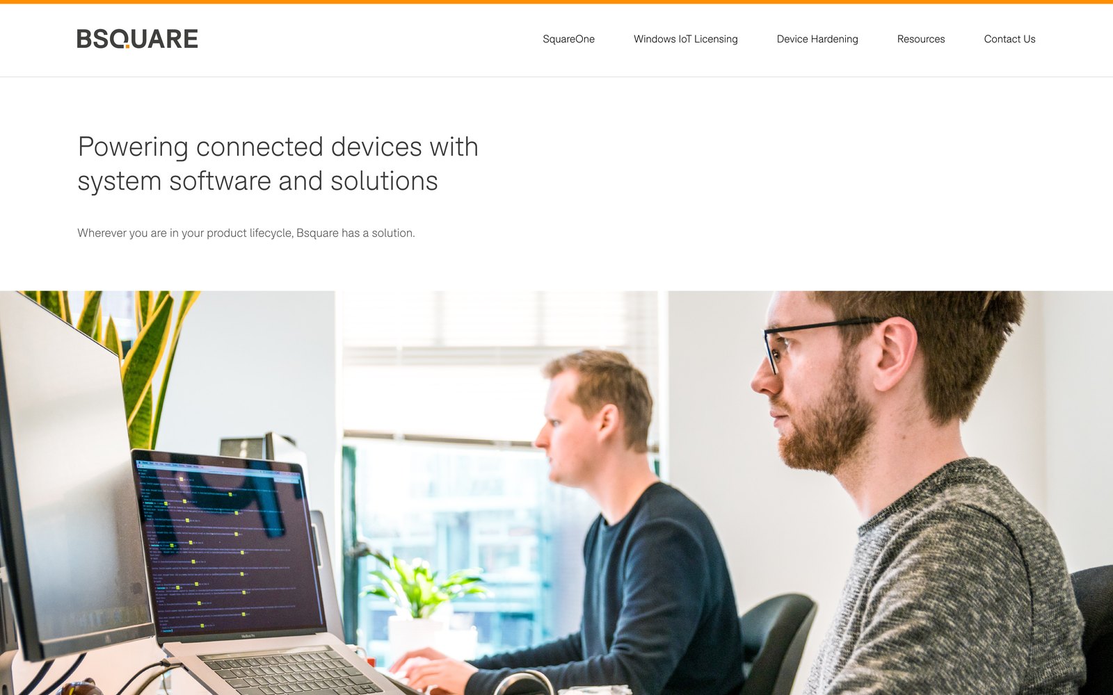 The redesigned homepage: left-aligned headline, a full-width photo, and product cards with the orange accent